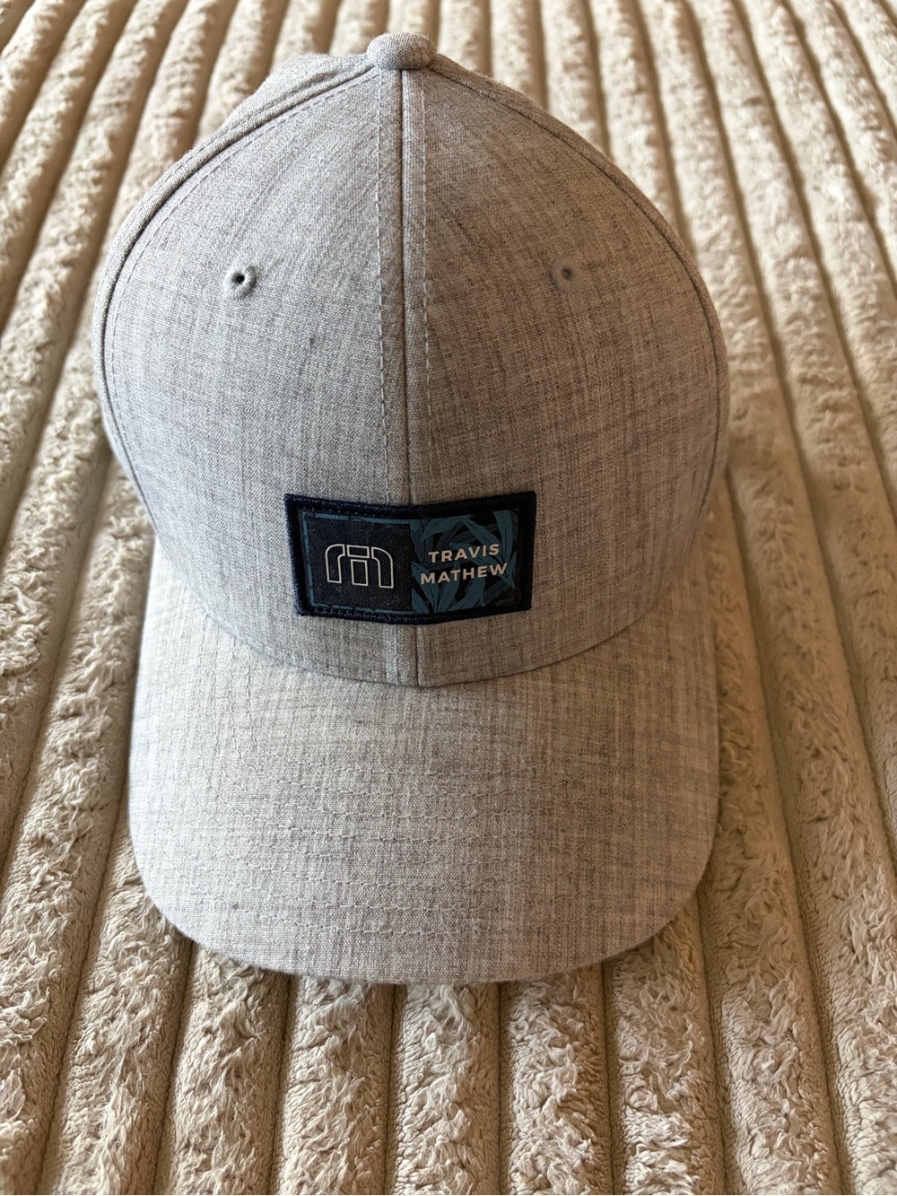 Travis Mathew Heather Gray Baseball Hat with Navy Logo Patch
